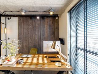 Mini blinds installed in a living room with a view of the outdoors